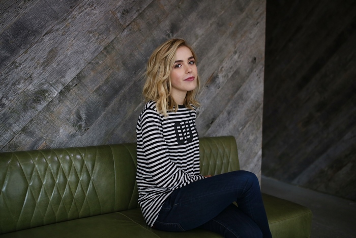 Kiernan Shipka on a green couch