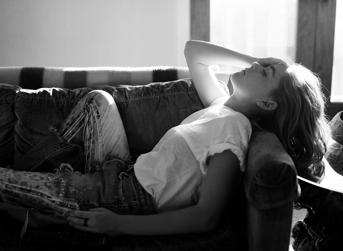 Kiernan Shipka lying on a couch