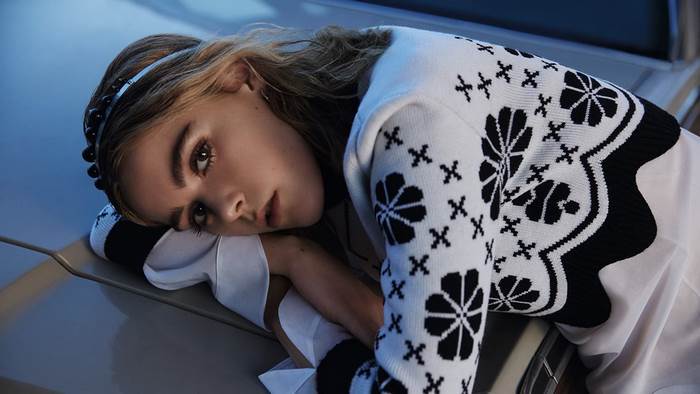 Kiernan Shipka wearing a black and white patterned sweater