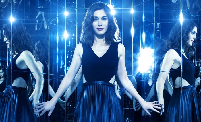 Lizzy Caplan in a mirrored room