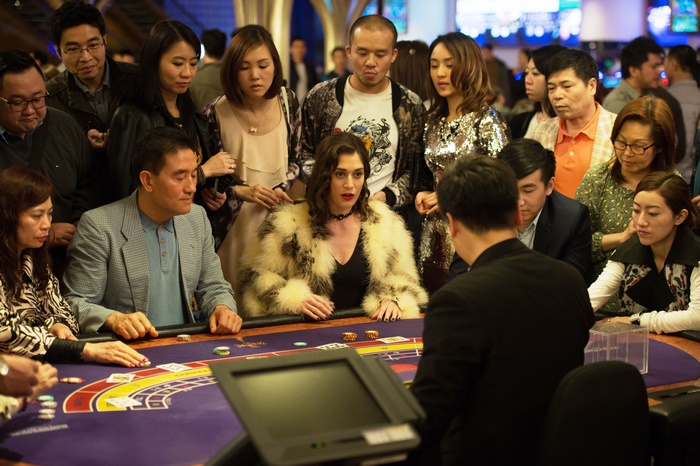 Lizzy Caplan at a casino table