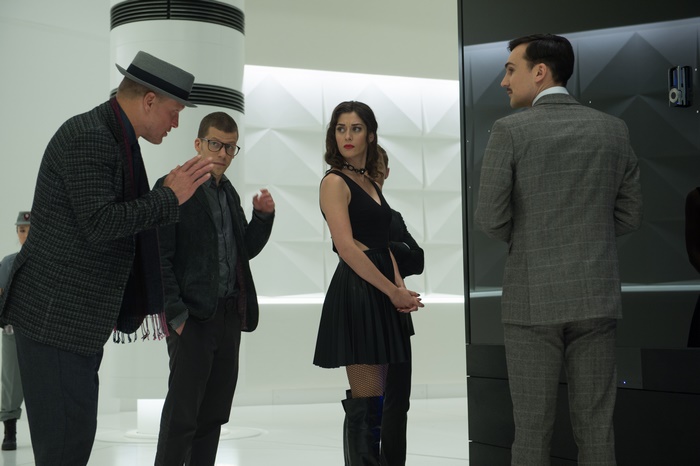 Lizzy Caplan and Woody Harrelson in a modern interior