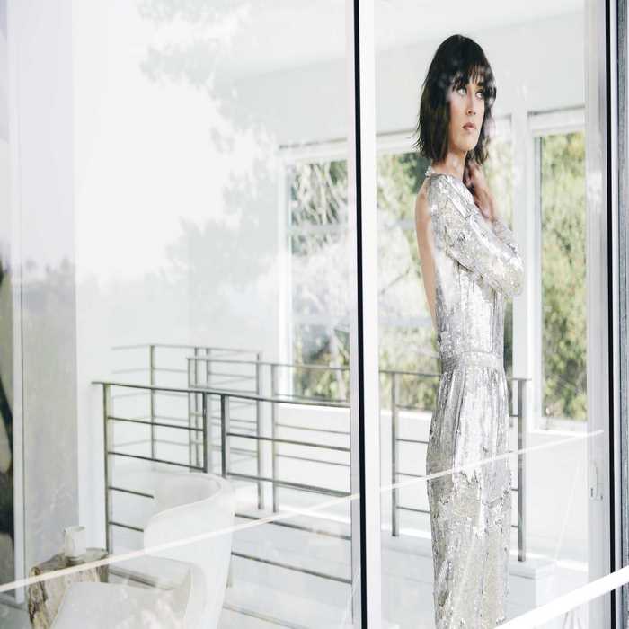 Lizzy Caplan in a silver sequined dress