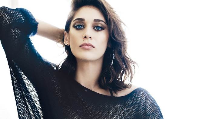 Lizzy Caplan in a black mesh top