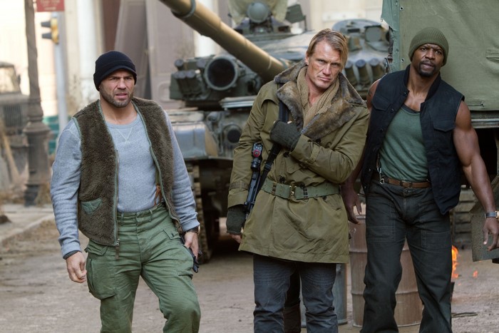 Three men with a tank