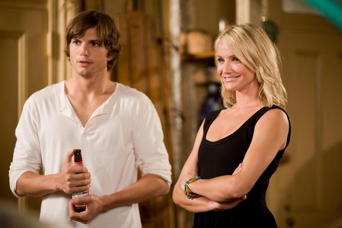 Ashton Kutcher holding a beer bottle