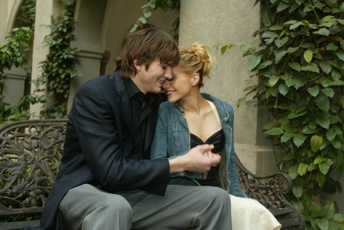 Ashton Kutcher and woman on bench