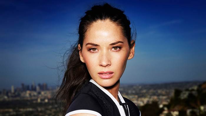 Olivia Munn in front of Los Angeles skyline