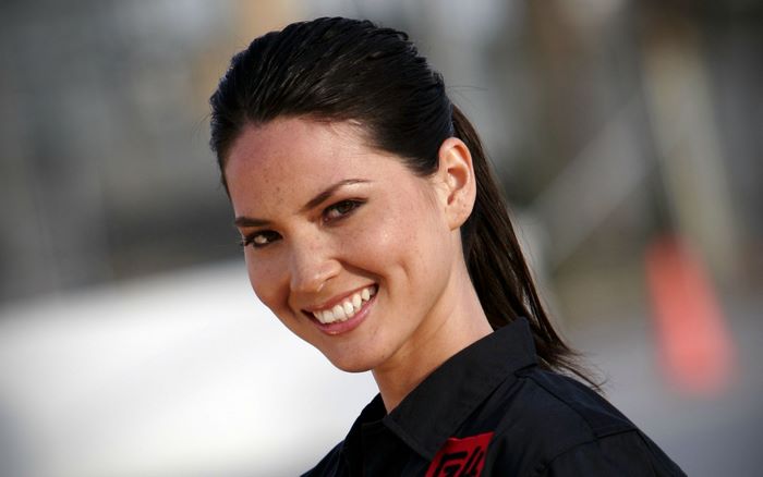 Olivia Munn in a black uniform