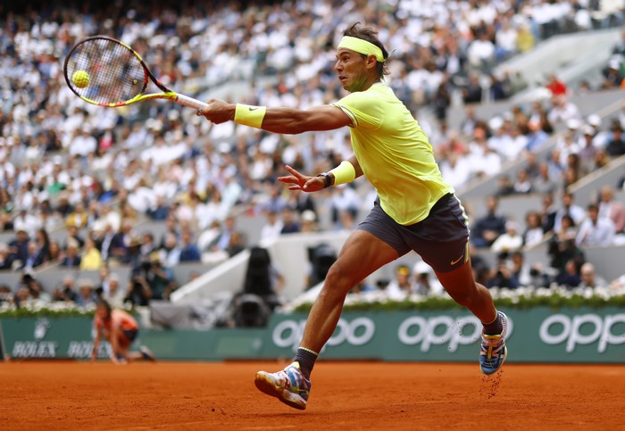 Rafael Nadal playing tennis at Roland Garros
