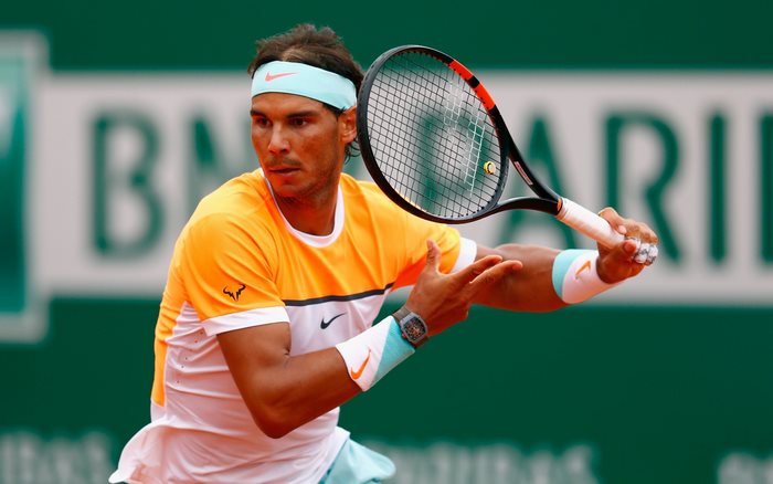 Rafael Nadal playing tennis