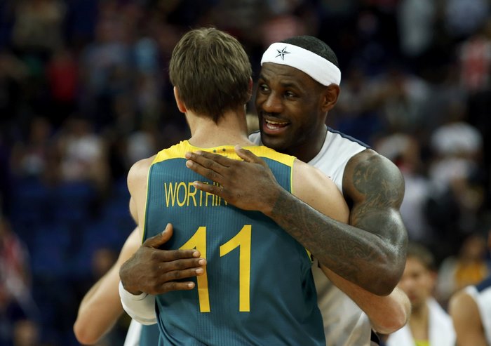 LeBron James hugging basketball player wearing number 11