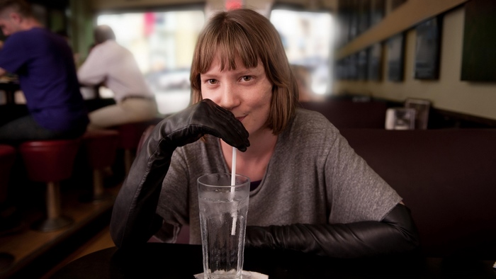 Mia Wasikowska drinking from a glass