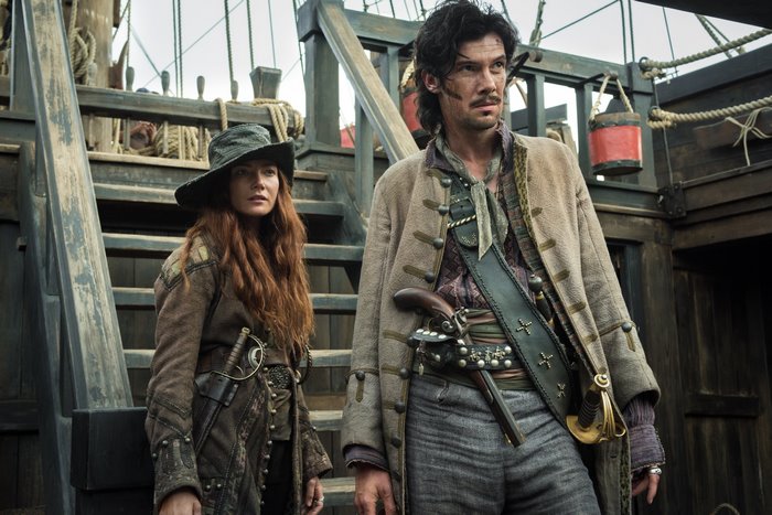 Toby Schmitz and a woman on a pirate ship