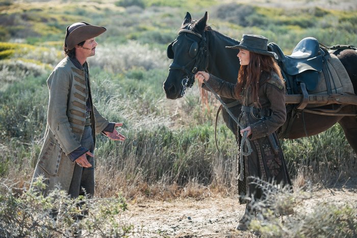 Toby Schmitz with a woman and a horse