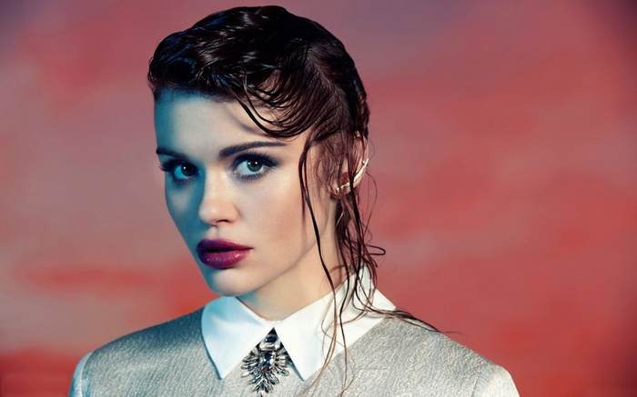 Woman with wet hair and dramatic makeup