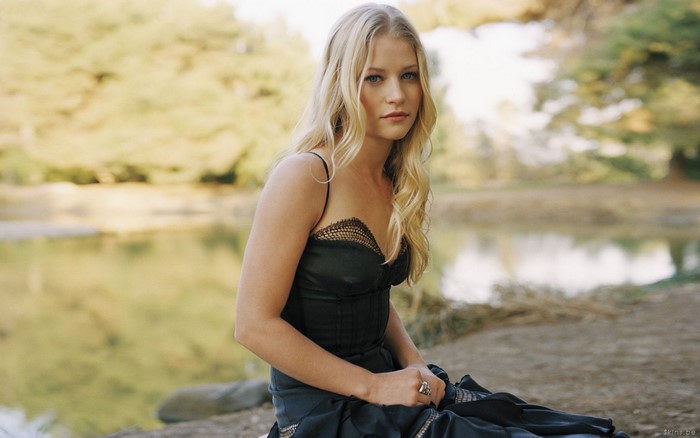 Emilie de Ravin sitting by a lake