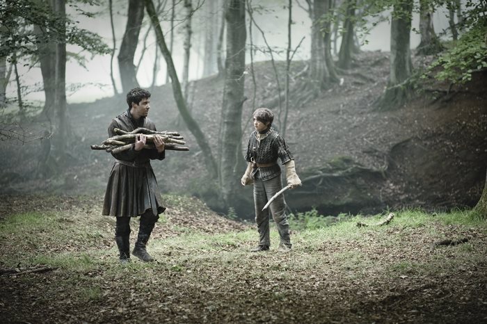 Joe Dempsie in a forest