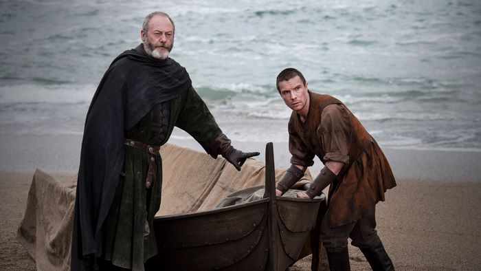 Liam Cunningham and Joe Dempsie on a beach