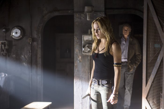 Caity Lotz in a dark industrial setting