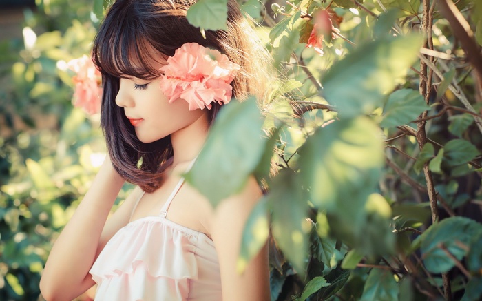 Young woman with flowers in her hair