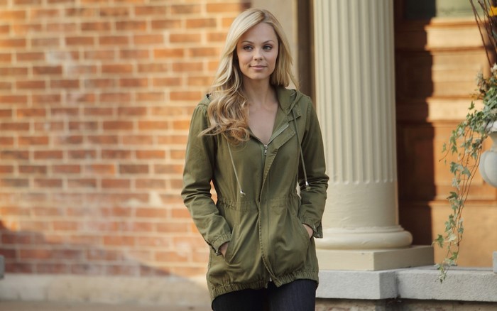 Laura Vandervoort in a green jacket