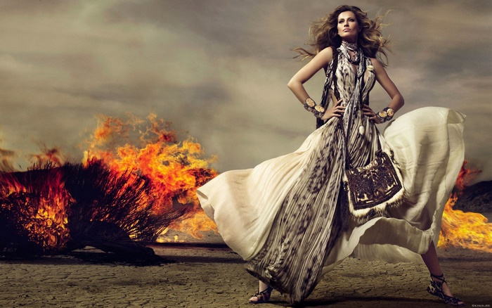 Gisele Bündchen in a desert with fire