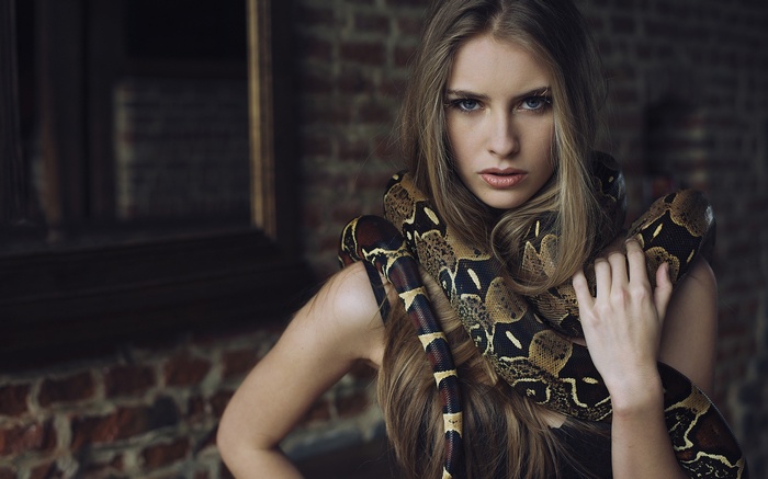 Woman with a snake around her neck