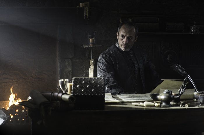 Stephen Dillane in a dimly lit room