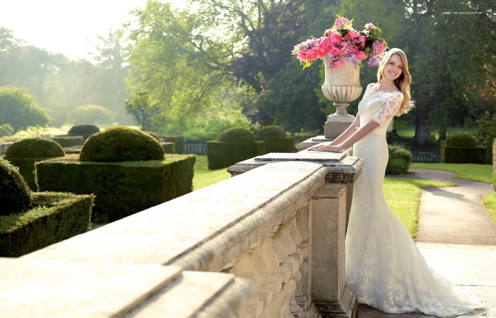 Lindsay Ellingson in a wedding dress in a garden