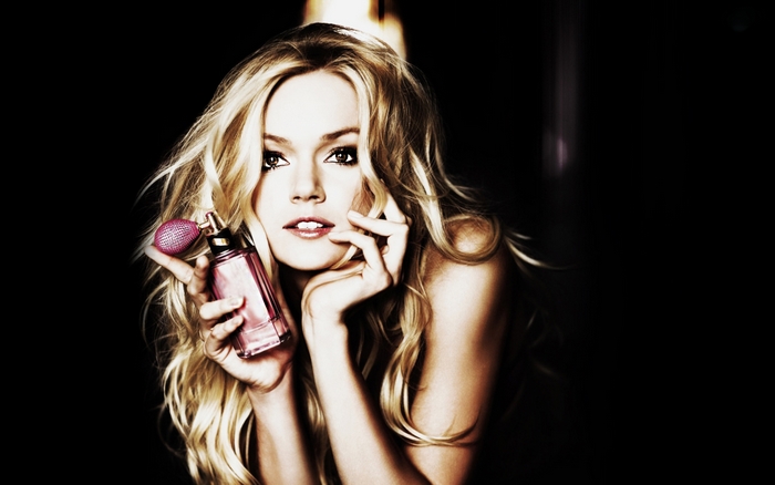 Lindsay Ellingson with perfume bottle