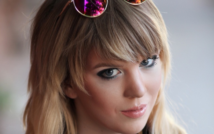 Woman with sunglasses on her head