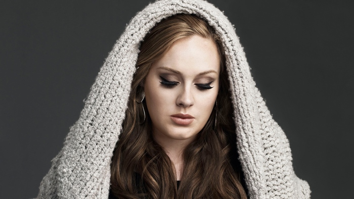 Adele wearing a grey hooded scarf