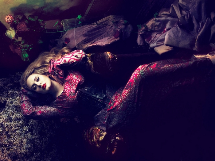 Adele lying down with roses