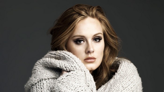 Adele wrapped in a cozy sweater