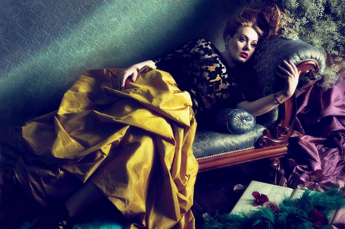 Adele lying on a chaise lounge