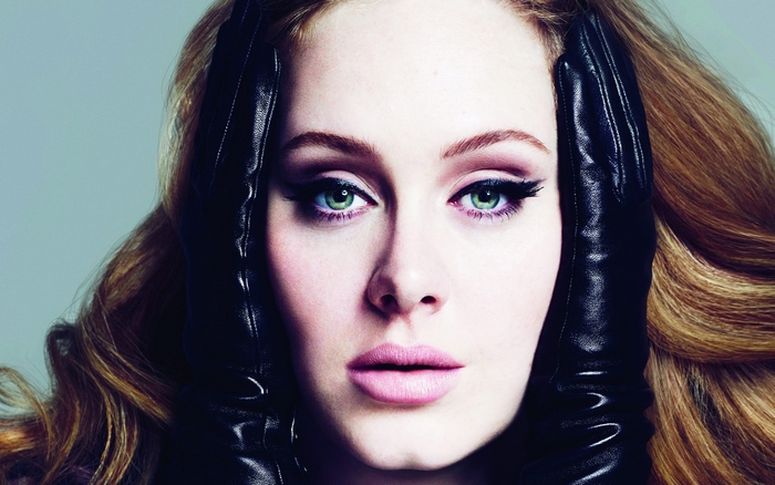 Adele wearing black gloves