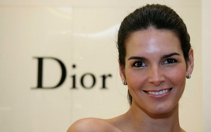 Angie Harmon in front of Dior logo
