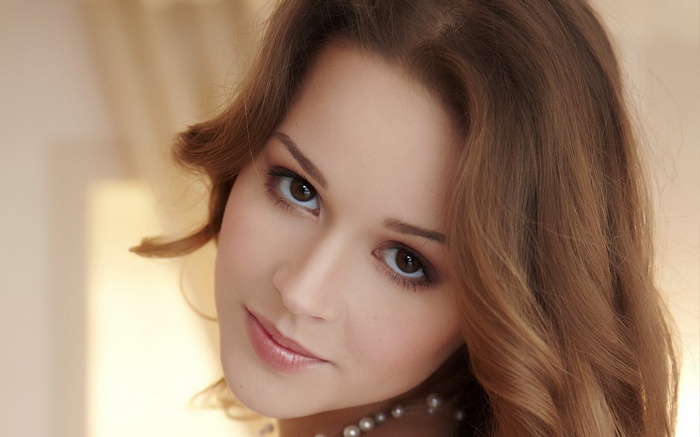 Close-up of a young woman with brown hair