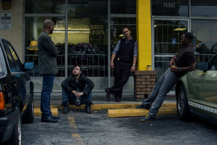 Chiwetel Ejiofor and men outside Robert L. Murray Funeral Home