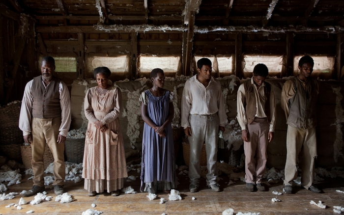 Six enslaved people in a barn