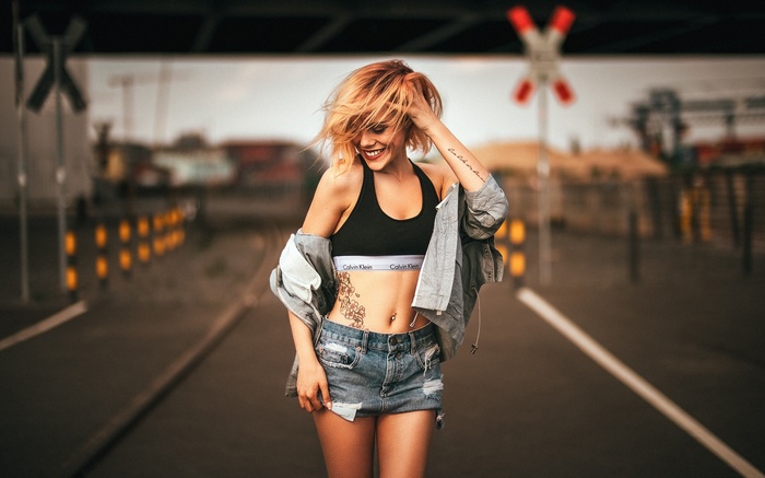 Woman in Calvin Klein bra and denim shorts