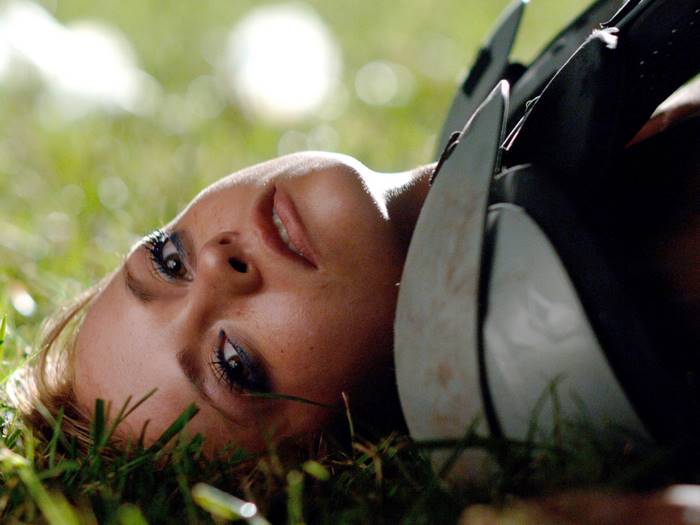 Christina Ricci lying in grass