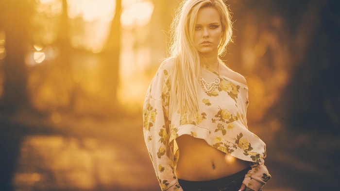Woman in floral crop top with necklace
