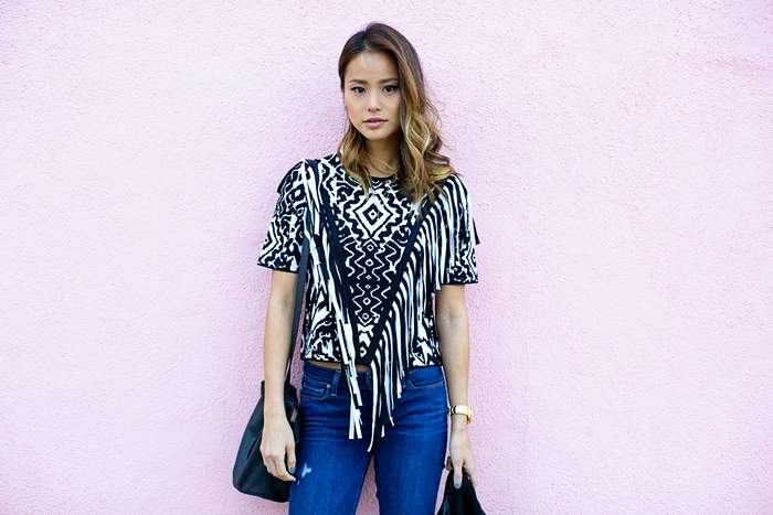 Jamie Chung in a patterned top and jeans