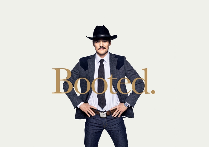 Pedro Pascal in a cowboy hat and suit