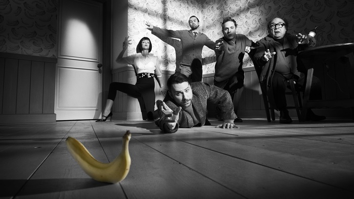 Rob McElhenney and cast in a scene with a banana