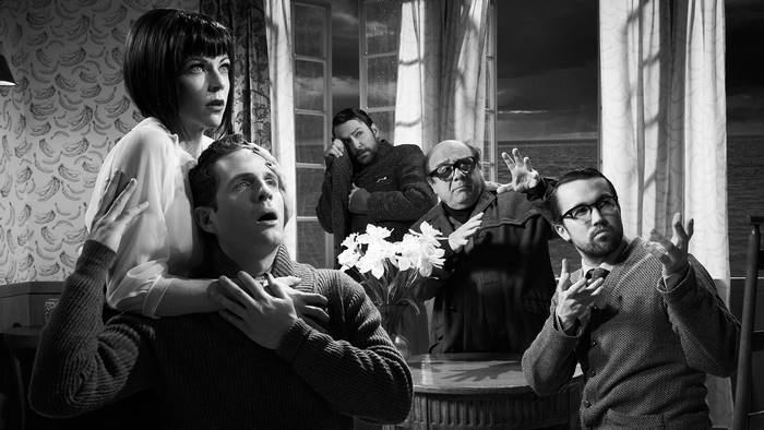Rob McElhenney and cast in a black and white scene