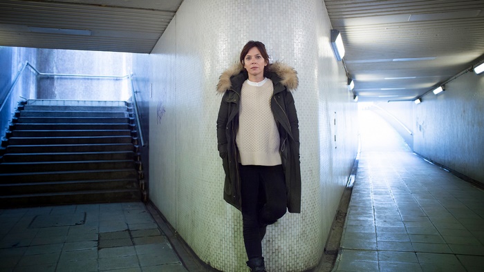 Anna Friel in a subway underpass