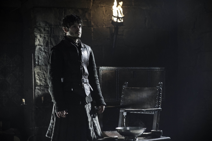 Iwan Rheon in a dark room